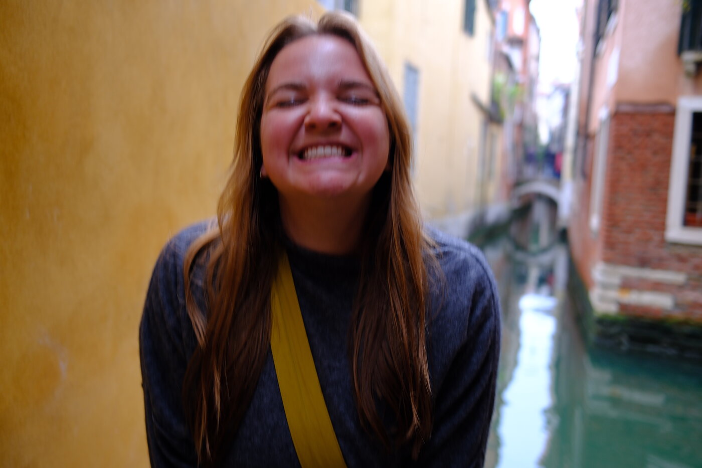 Emma laughing beside a canal in Venice